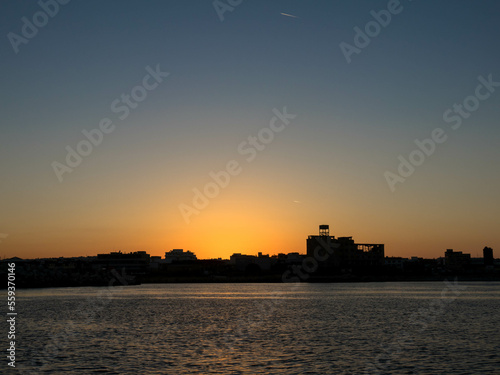 Panoramic view. Sunset over Rhodes town and port. Beautiful sky with space for text.