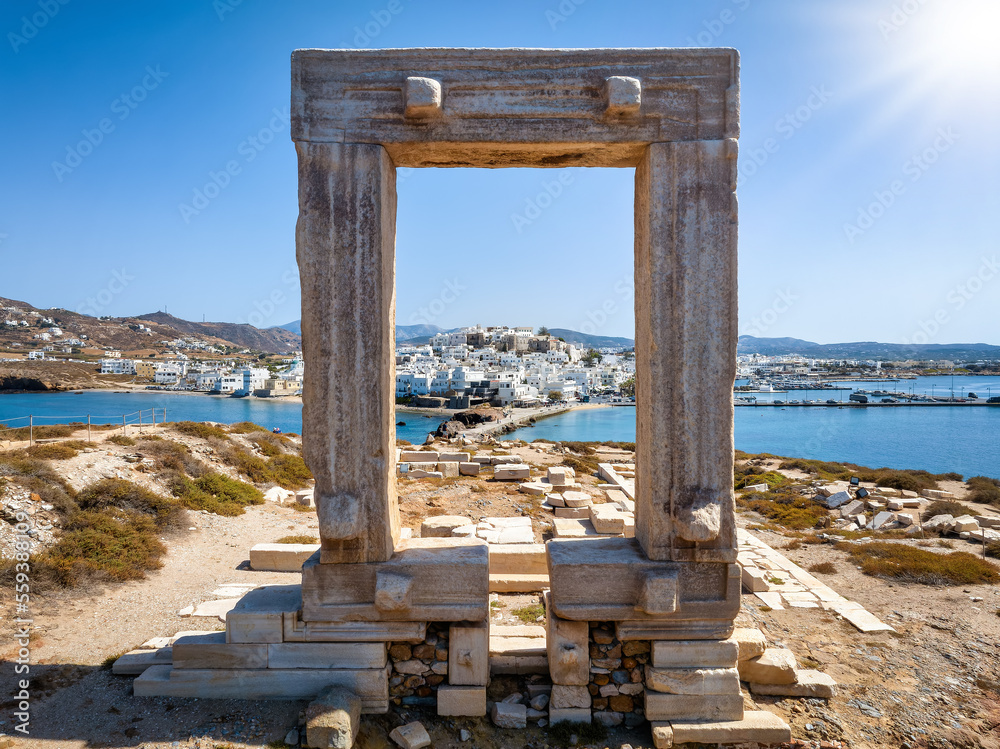 View through the famous Portara marble gate of Naxos island to the city and harbour, Cyclades, Greece