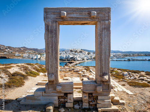 View through the famous Portara marble gate of Naxos island to the city and harbour, Cyclades, Greece