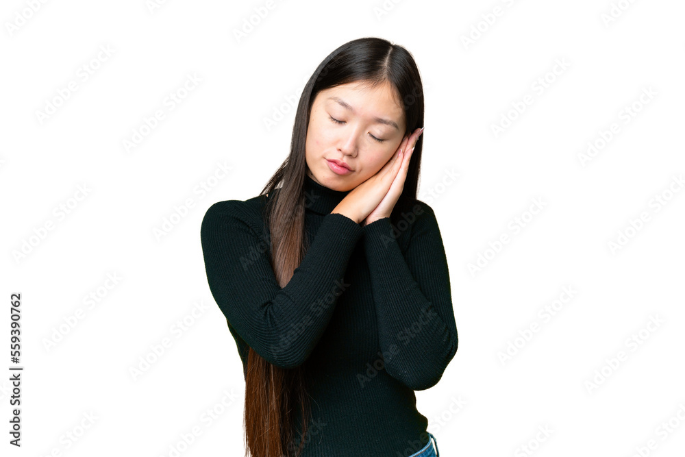 Young Asian woman over isolated chroma key background making sleep gesture in dorable expression Young Asian woman over isolated chroma key background making sleep gesture in dorable expression