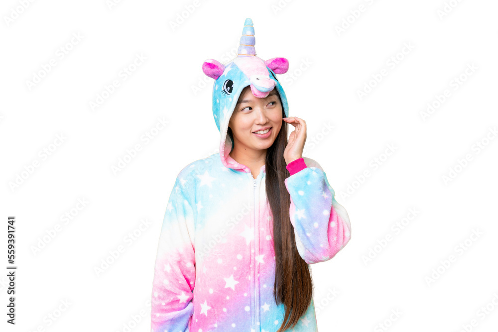 Young Asian woman with unicorn pajamas over isolated chroma key background thinking an idea Young Asian woman with unicorn pajamas over isolated chroma key background thinking an idea
