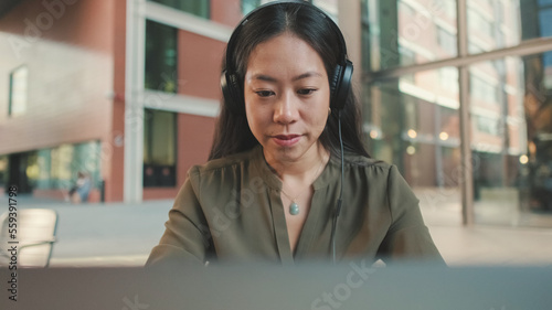 Young woman freelancer working on laptop