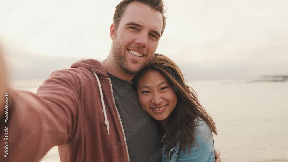 Fototapeta premium Laughing couple talking on video call