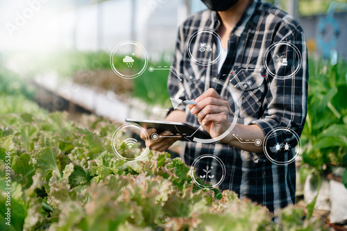 Smart farmer using application by tablet concepts modern agricultural technology and visual icon.