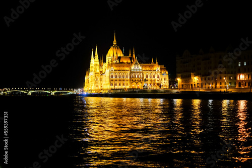 Budapest parliament from Danube river in the night, Hungary photo