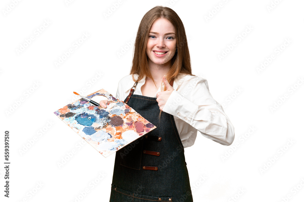 Young artist woman holding a palette over isolated chroma key background giving a thumbs up gesture Young artist woman holding a palette over isolated chroma key background giving a thumbs up gesture