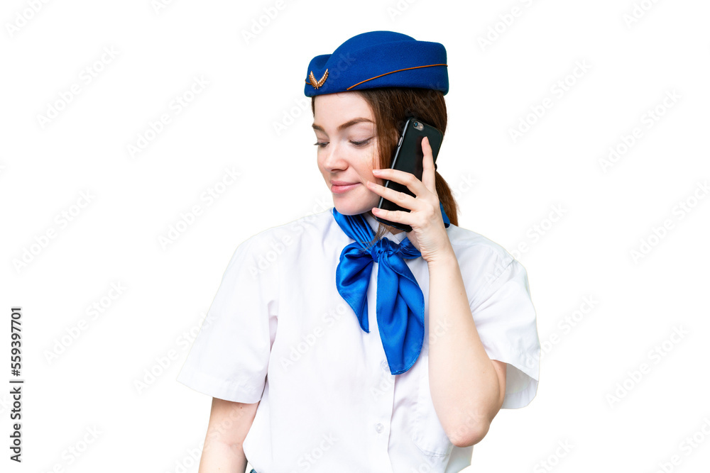 Airplane stewardess over isolated chroma key background keeping a conversation with the mobile phone with someone Airplane stewardess over isolated chroma key background keeping a conversation with the mobile phone with someone