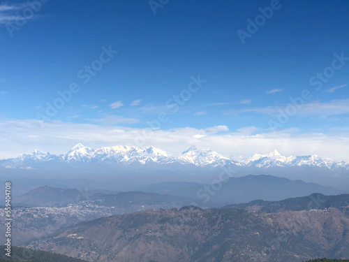 Himalaya mountains surrounded by clouds and snowy peaks