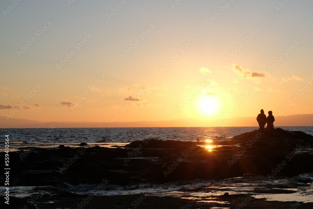 sunset on the beach of Enoshima island with tourist