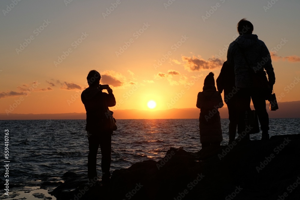 sunset on the beach of Enoshima island with tourist