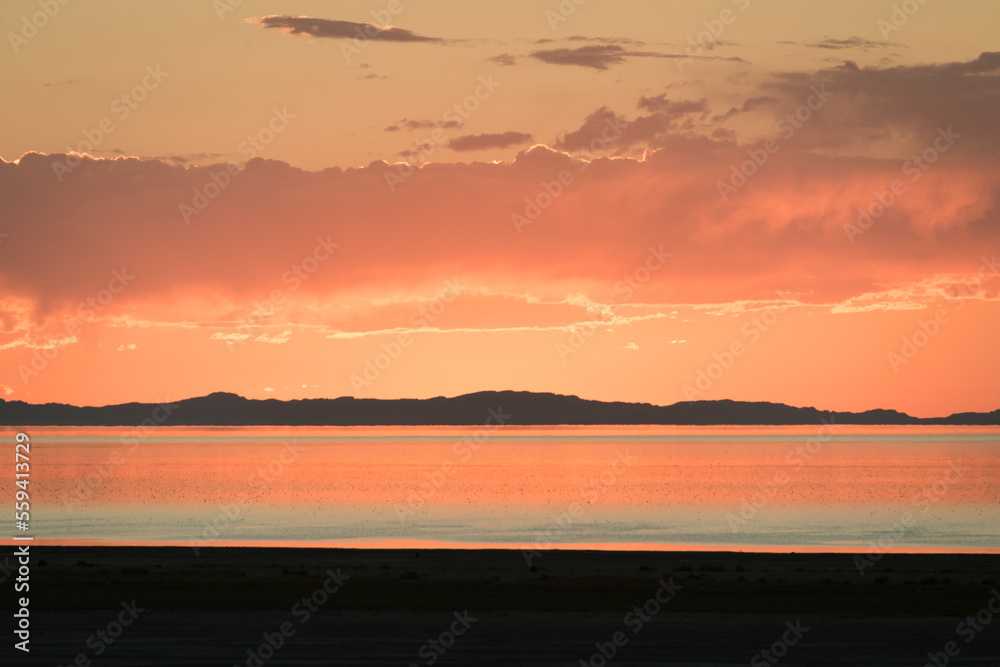 sunset in red and orange over the great salt lake, utah
