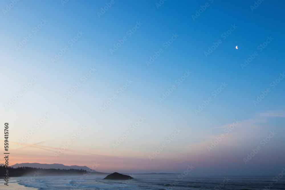 Scenic view of beach against blue sky during sunset Scenic view of beach against blue sky during sunset