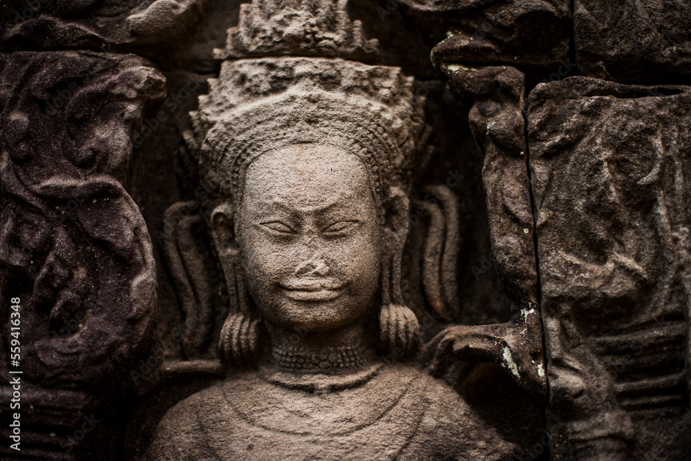 Stone carved diety at the temple of , Angkor Wat, Siem Reap, Cambodia. Stone carved diety at the temple of , Angkor Wat, Siem Reap, Cambodia.