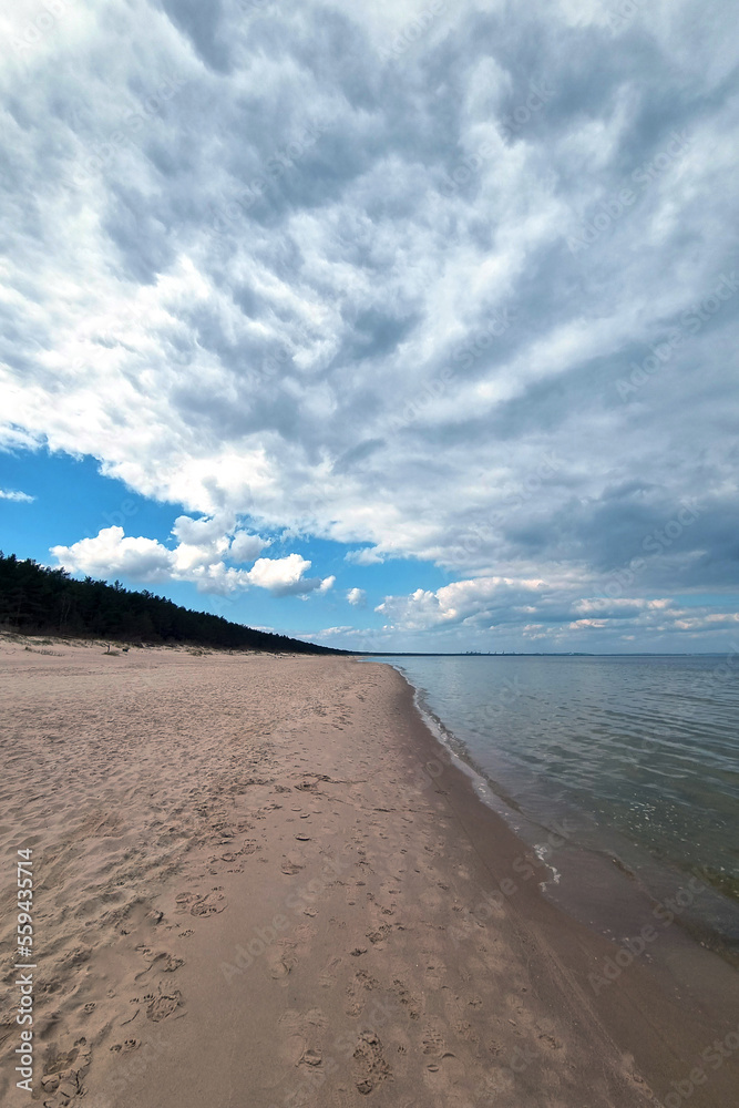 Sandy coast of the Baltic Sea. Rest on the sea. Active recreation.