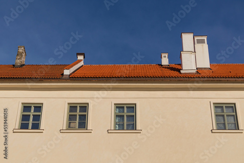 The facade of an old building has been restored and the clay tile roof has been restored
