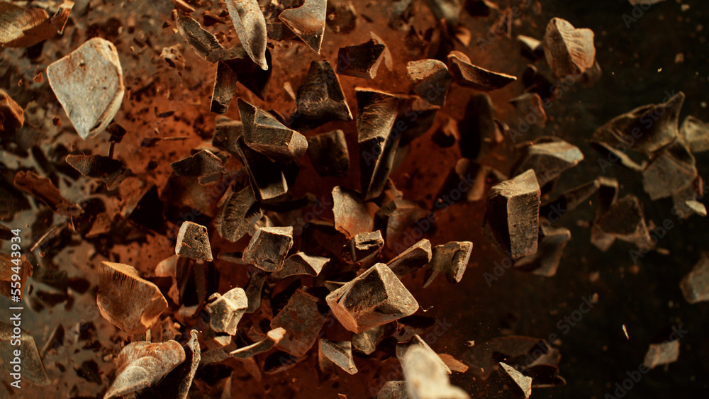 Freeze motion of flying group of raw chocolate pieces. Freeze motion of flying group of raw chocolate pieces.