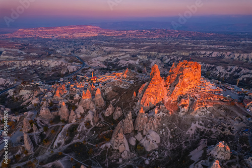 Ancient town of Uchisar castle at sunset Landscape Goreme national park, Cappadocia Turkey, aerial top view