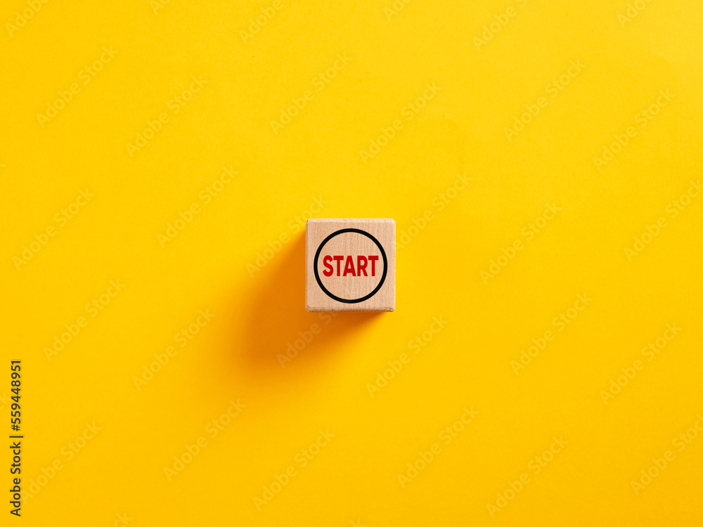 The word start on a wooden cube. To make a new start in life, business, education or career concept. Start button. - obrazy, fototapety, plakaty 