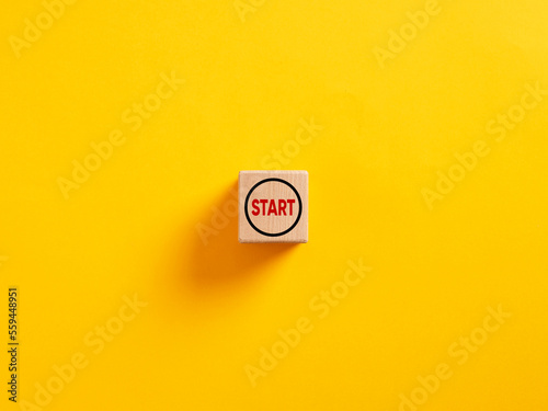 The word start on a wooden cube. To make a new start in life, business, education or career concept. Start button.