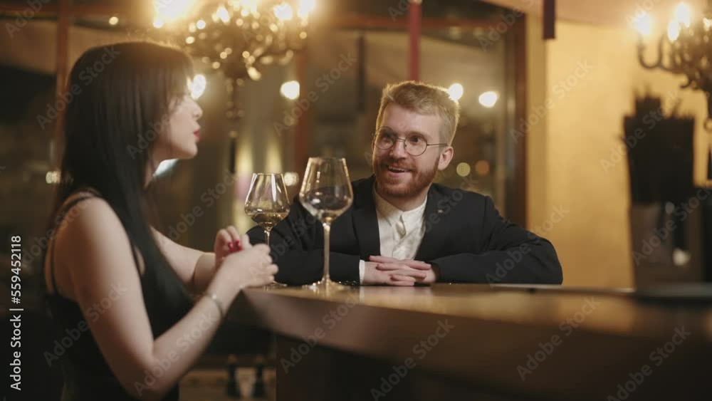 attractive man meeting with beautiful lady in bar, first date and acquaintance in party, nice talk attractive man meeting with beautiful lady in bar, first date and acquaintance in party, nice talk