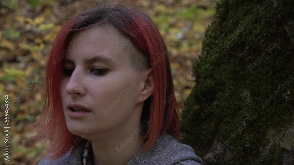 A maniac attacks a woman in the forest. A crazy male killer is chasing a frightened victim A maniac attacks a woman in the forest. A crazy male killer is chasing a frightened victim