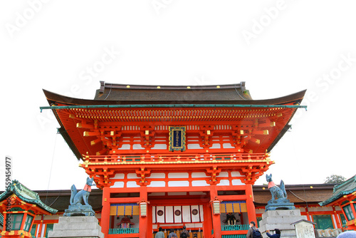 Photography Tokyo, Japan-January 10, 2023:  Fushimi Inari Taisha shrine and dog statue in front of entrance or access with sky background