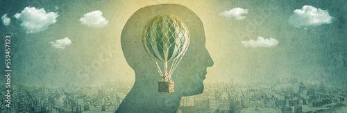 Silhouette of a man with a balloon, an aerostat as a symbol of freedom of thought. Concept , idea on the theme of psychiatry, psychology, religion, science.