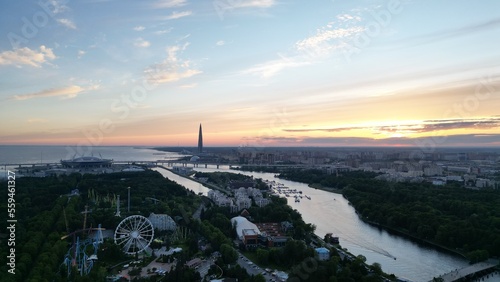 Amazing sunset view over the river in a European city. Drone view