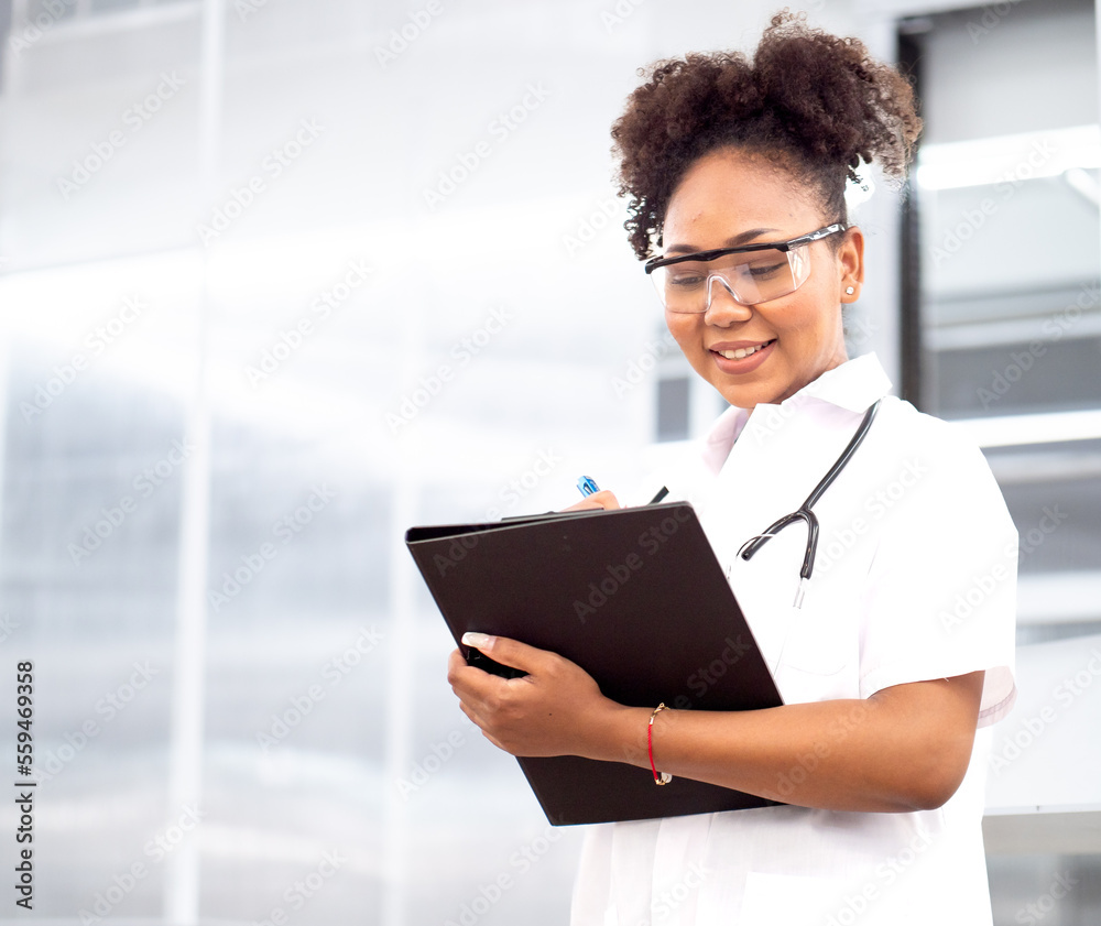 Female medical student, doctor in uniform holding clipboard working in hospital. Portrait of woman health care nurse with stethoscope works in clinic. Healthcare and medicine professional occupation.
