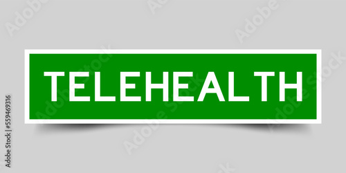 Green color square shape sticker label with word telehealth on gray background