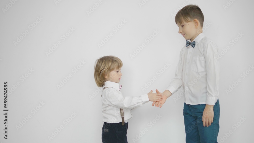 Funny kids learn to shake hands and high five