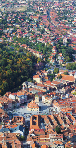 Aerial top view of the Council Square, the Black Church and the historical center of Brasov city in Romania