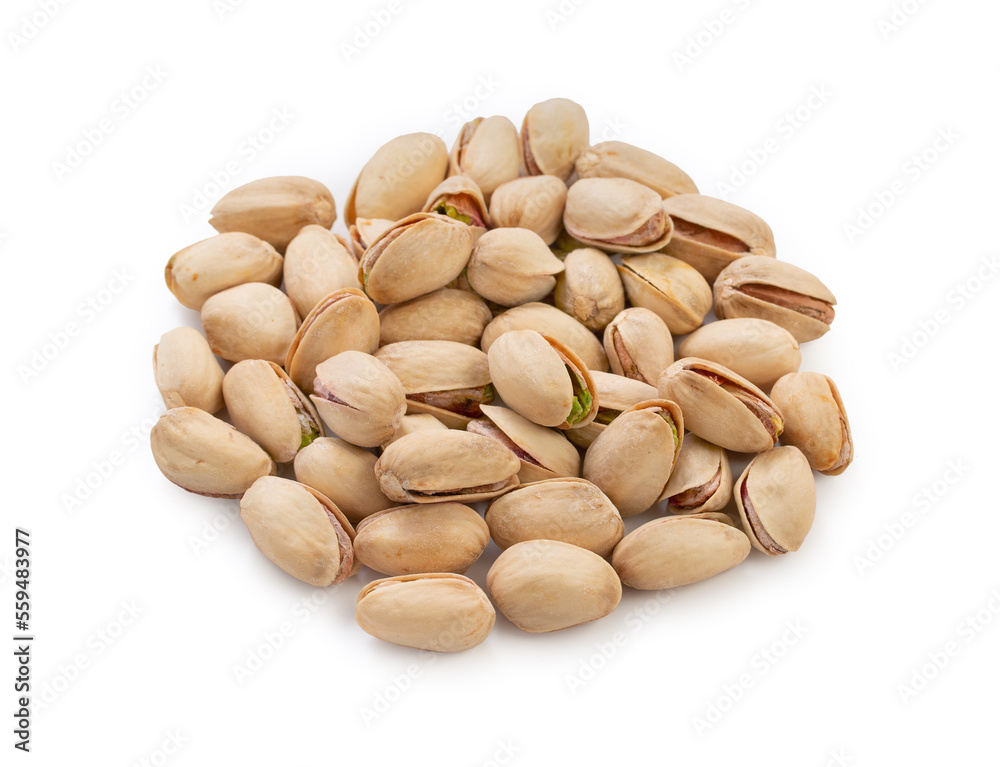 Heap pistachios isolated on white background, close up. Heap pistachios isolated on white background, close up.