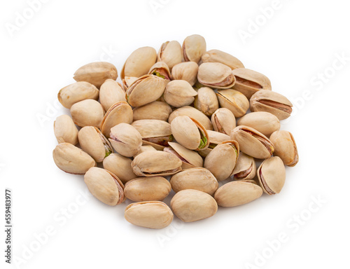 Heap pistachios isolated on white background, close up.