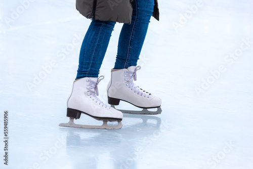 legs of a skater on an ice rink. hobbies and winter sports