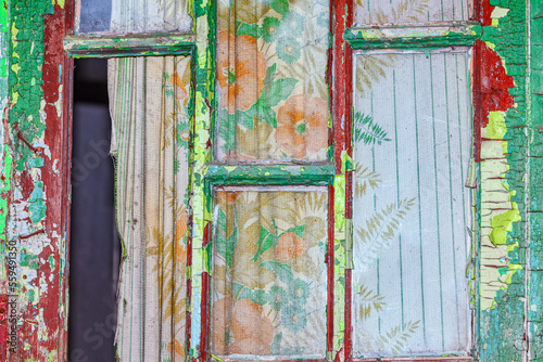 Window of abandoned house . Old window with curtains