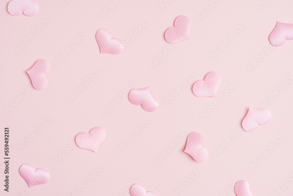 Background pattern pink heart on peach colored paper.