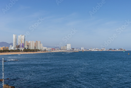 View of the ocean with a lot of architecture along the coastline © JLPD