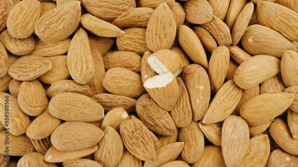 Almond seeds view from top. Heap of peeled almonds nuts Almond seeds view from top. Heap of peeled almonds nuts