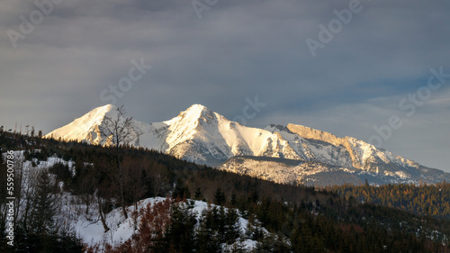 View of the landscape with snowy mountains in the background. High Tatras National Park, Slovakia, Europe.