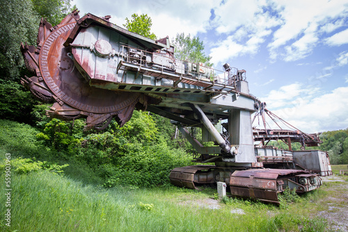 Abandoned huge coal mining digging machine parked somewhere on an old coal mine area