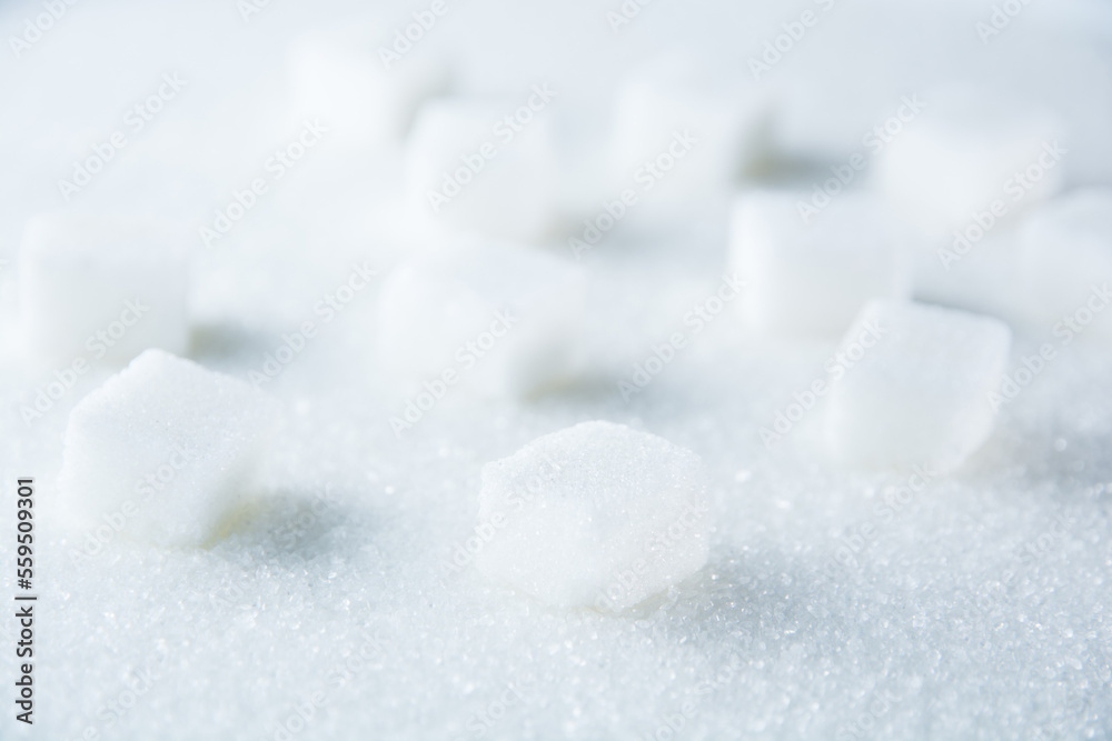 A stack of sugar cubes on a sugary surface. A stack of sugar cubes on a sugary surface.