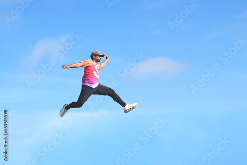 Fototapeta Naklejka Na Ścianę i Meble -  person jumping. person jumping in the air