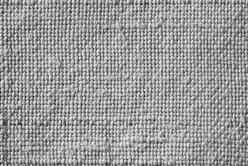 Fabric texture. Canvas background. The texture of a rough gray cloth. Macro image from canvas