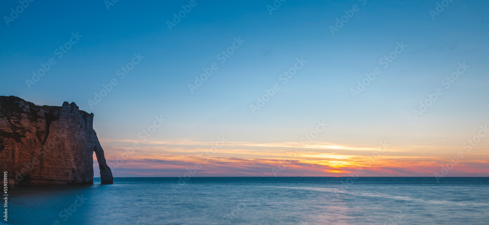 panoramic view of the white coast of etretat france at sunset - travel concept