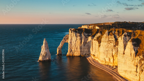 panoramic view of the white coast of etretat france at sunset - travel concept