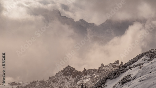 Stormy clouds in italian dolomites in a snowy winter