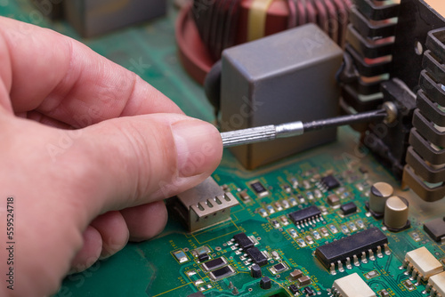 Soldering iron. Repairing electronic component