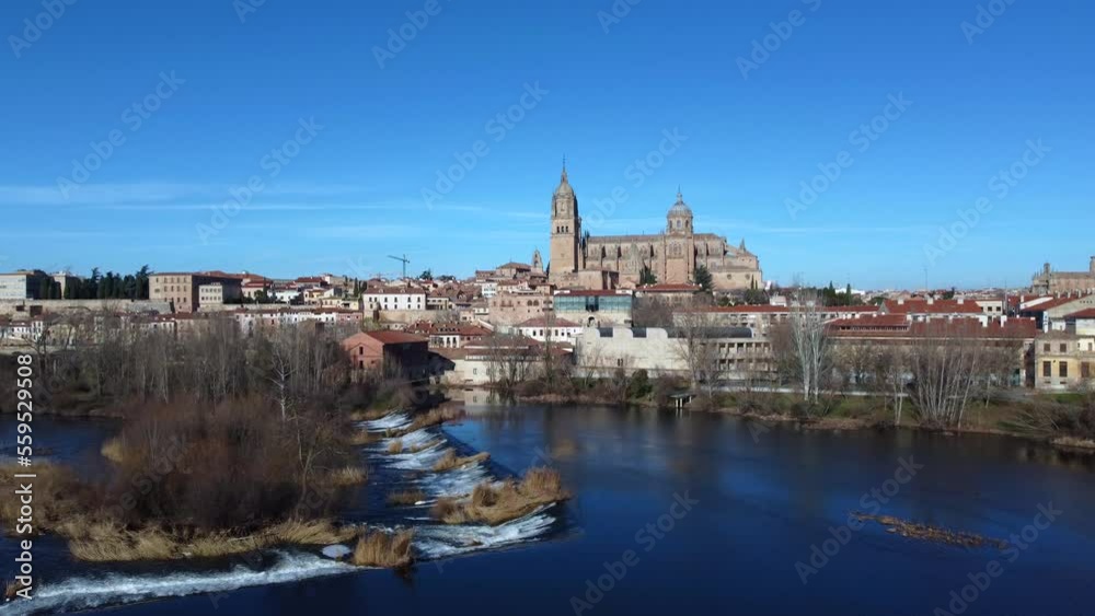 View of the Salamanca cathedral reflected in the Tormes river View of the Salamanca cathedral reflected in the Tormes river