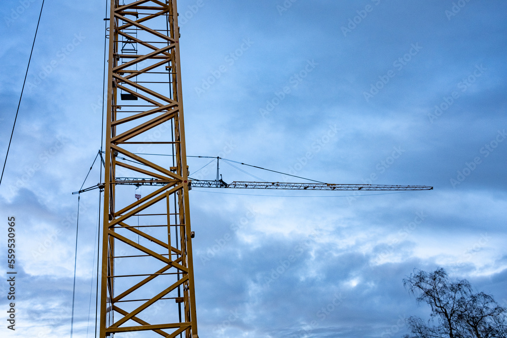 very high construction crane over construction site